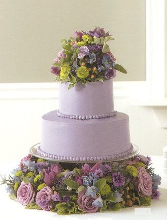 purple wedding cake decorated with flowers
