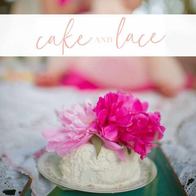 small white cake with pink flowers on top