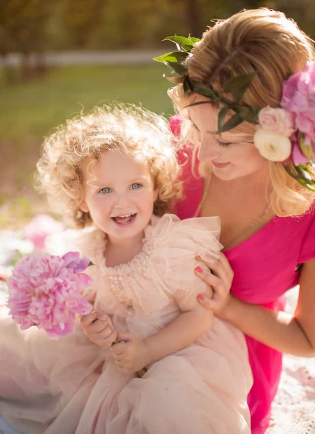 Mom looking at smiling daughter