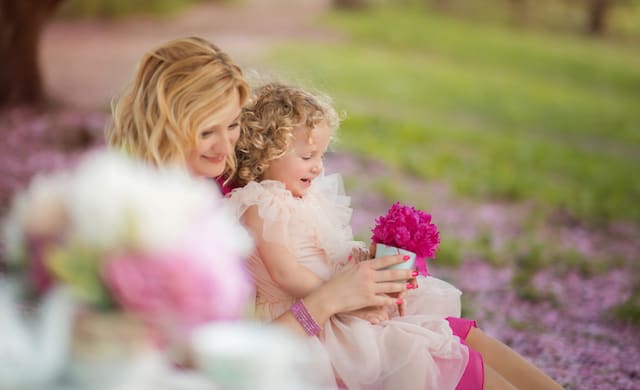 Featured on Cake and Lace pretty in pink Park tea party Mom and daughter looking at bright pink flower