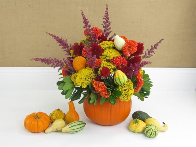 fall floral arrangement in a pumpkin