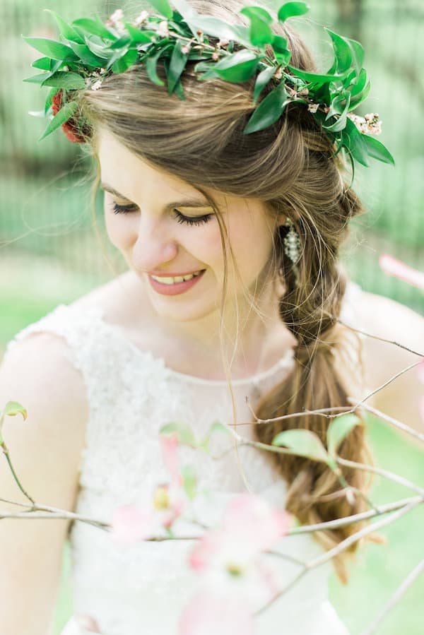 springtime blooms by the box smiling bride with floral crown