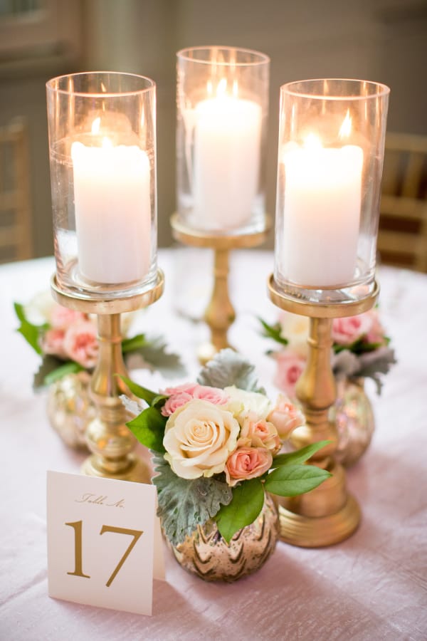 Maximize your DIY budget by accenting floral arrangements with candles!