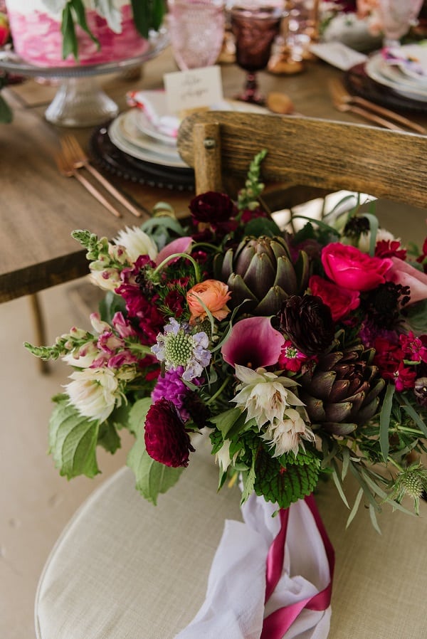 large white and red floral bouquet on a chair