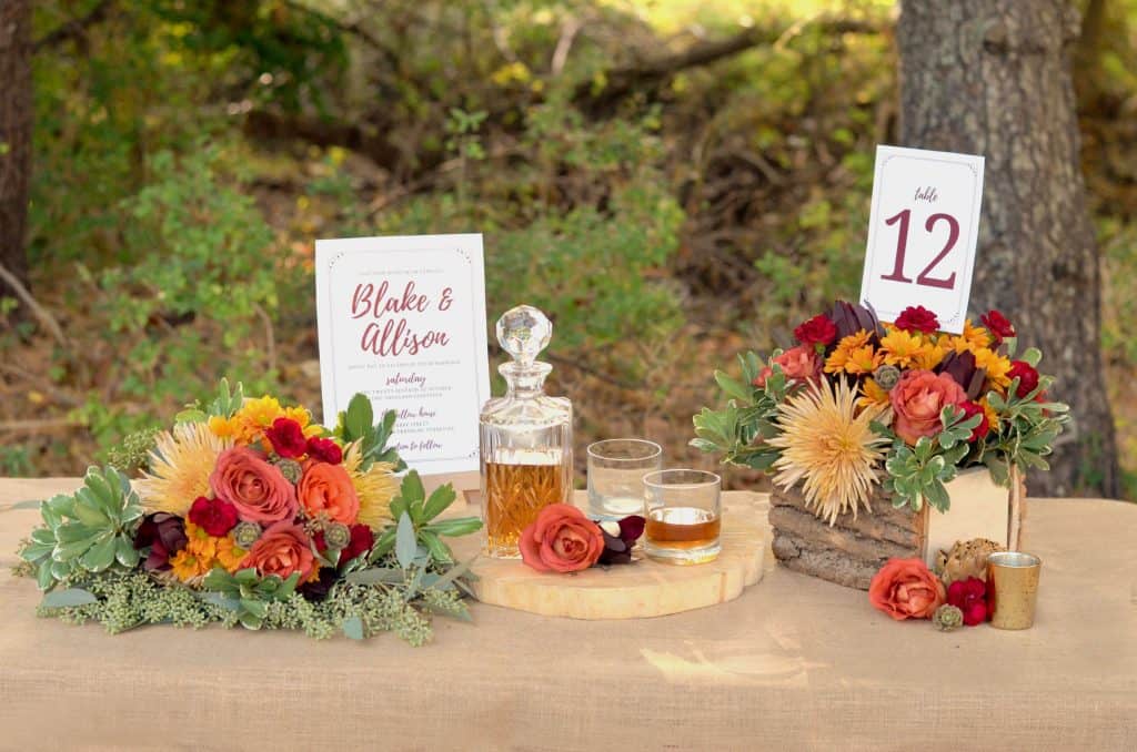 tablescape with glasses and namecard with fall flowers
