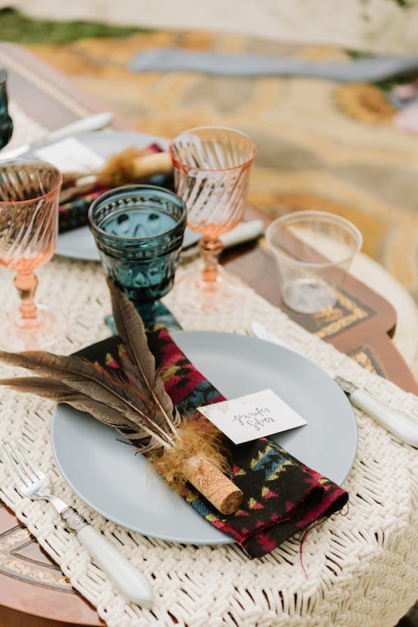 placesetting with decorative feathers and namecard