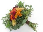 finished rustic bouquet with red orange and yellow flowers