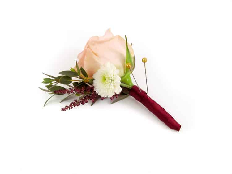 Burgundy cream and peach boutonniere