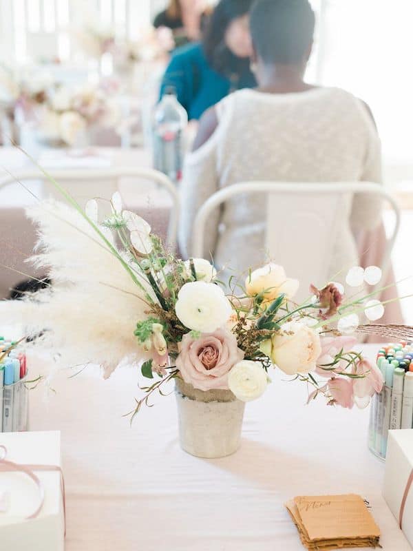 floral centerpiece on a pink tablecloth