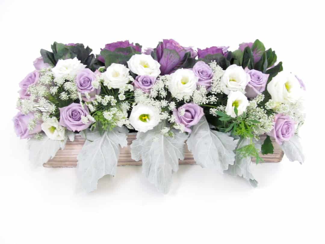 finished lavendar and mint centerpiece with purple and white flowers