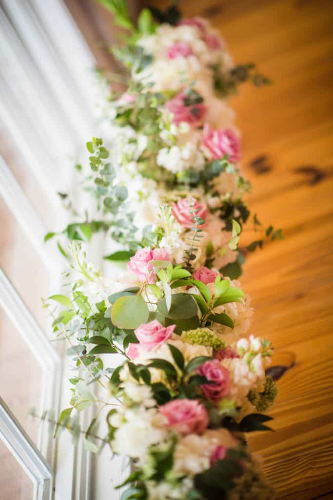 pink white and green decorative flower garland