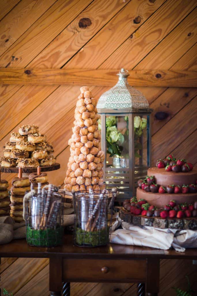 dessert bar decorated with flowers in a lantern