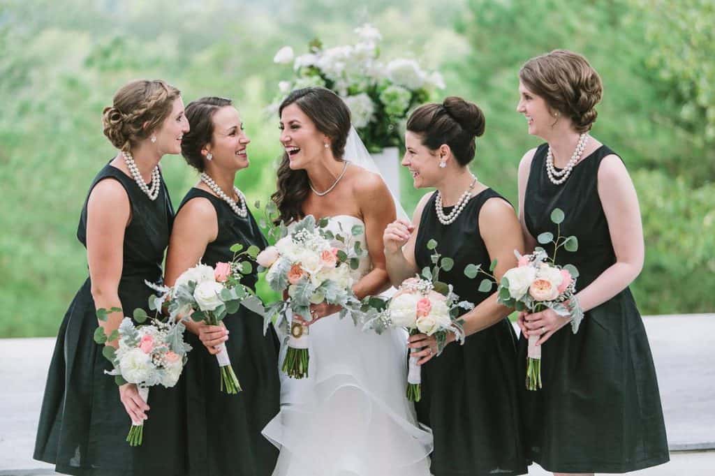 bride and bridesmaids laughing