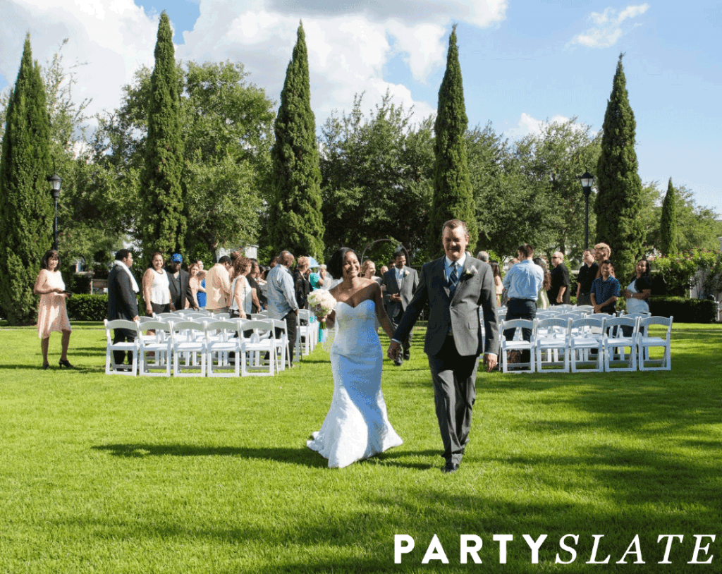 couple walking away from outdoor wedding scene