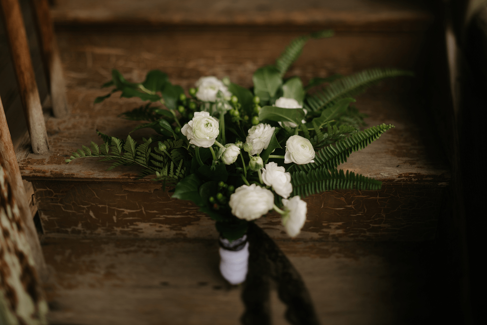 white flower with green fern bouquet