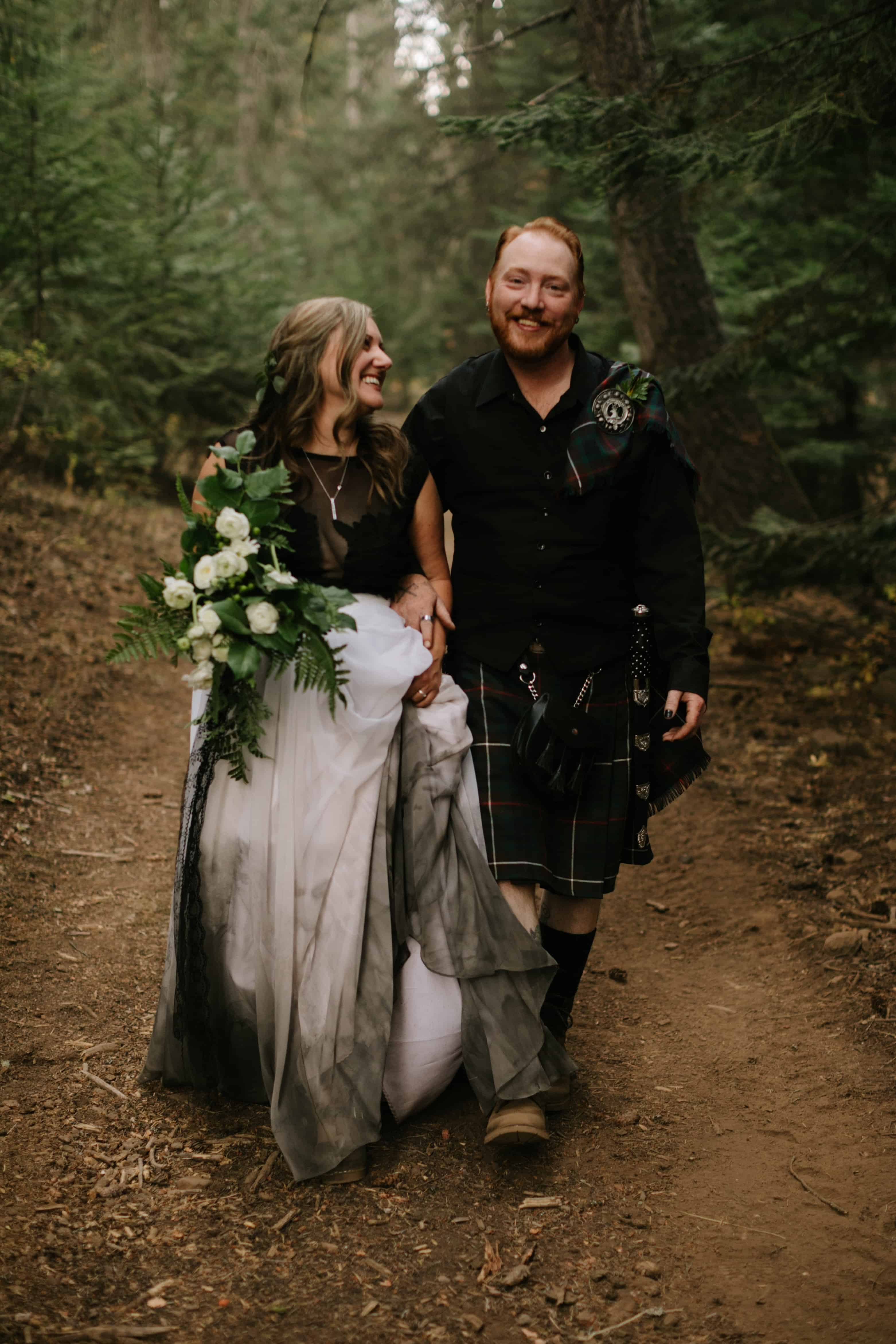 couple walking down path to Green Forest Wedding