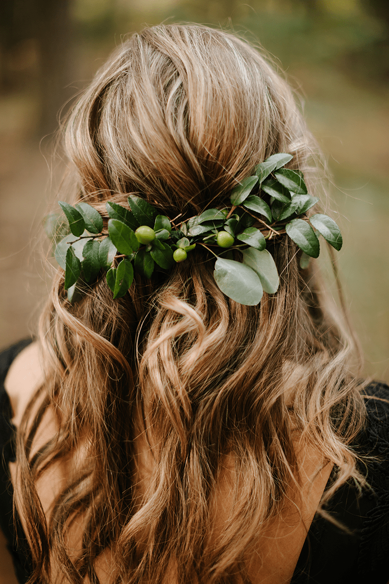 green forest wedding enormous tree and aisle lined with stumps topped with jars with a flower in it
