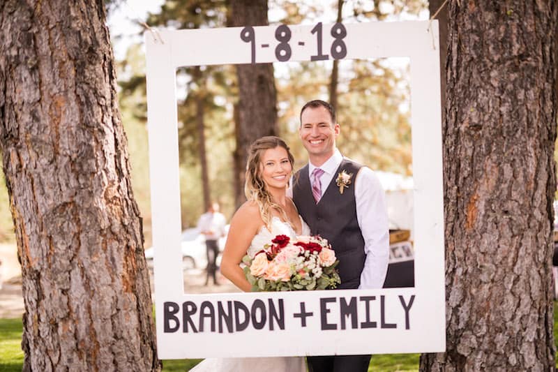 Cowboy Boot Wedding couple in a large frame with the words Brandon and Emily