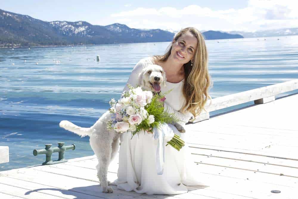 amazing Lake Tahoe Wedding Bride on dock with dog and lake background