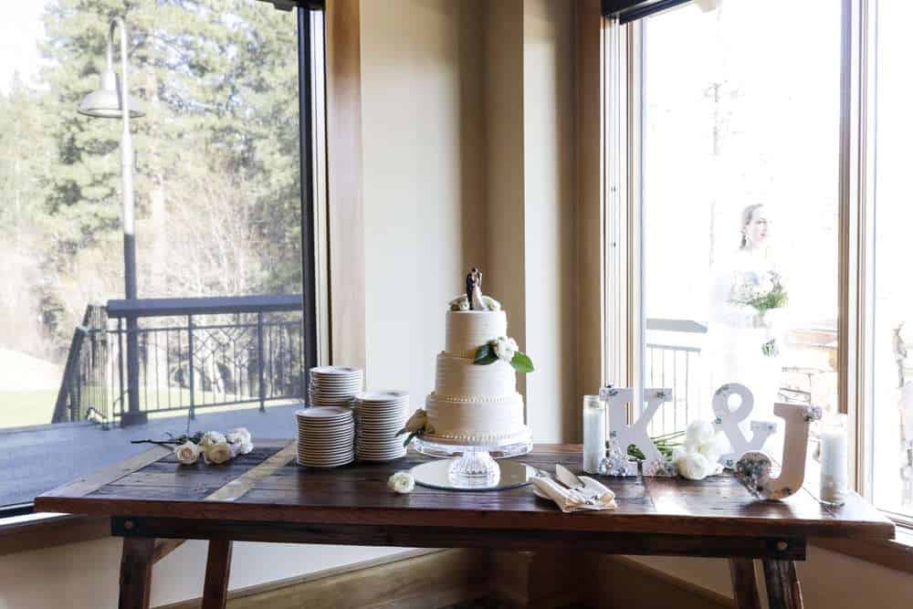 Table with wedding cake and K & J wooden cutout
