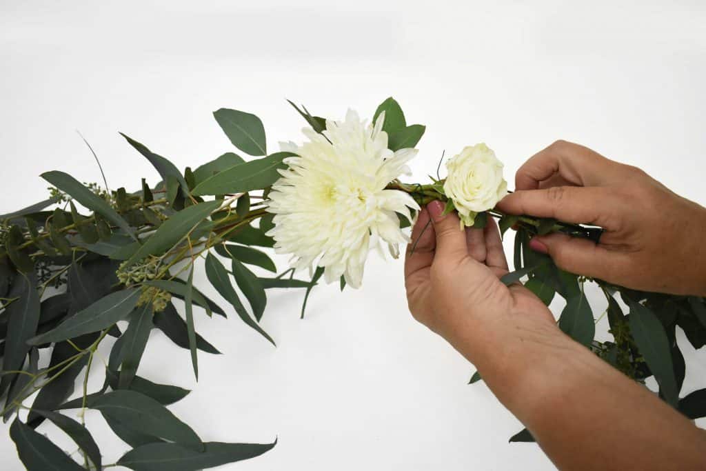 Adding flowers to DIY Wedding Welcome Sign