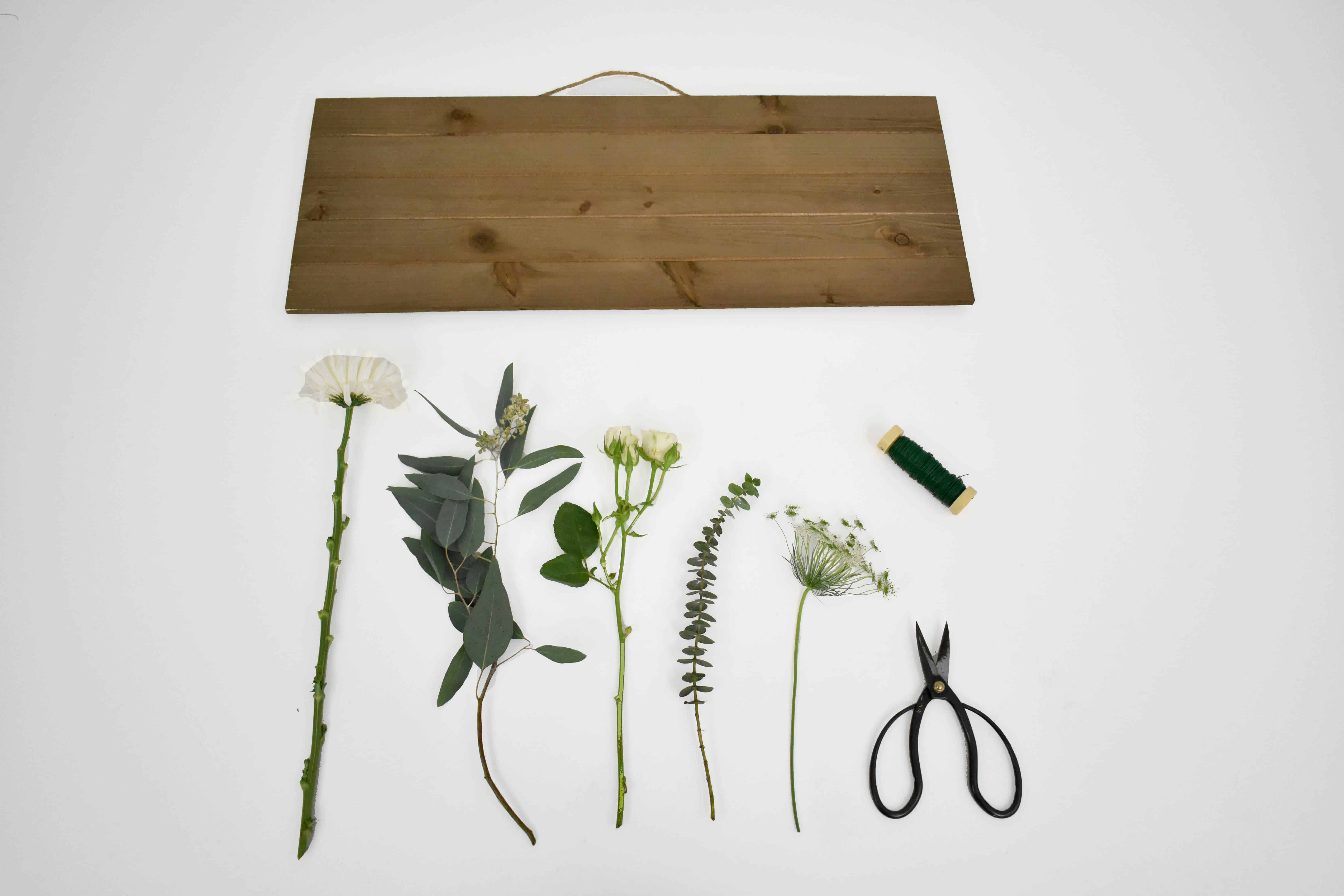 DIY Wedding Welcome Sign supplies white mums, white roses, queen Anne's lace, blue eucalyptus and seeded eucalyptus