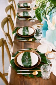 large green tropical leaf under plate as a place setting