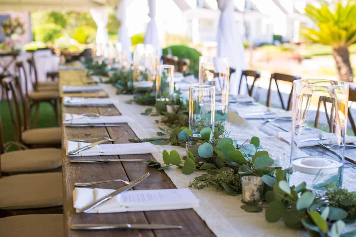 long green garland runner on a wooden table