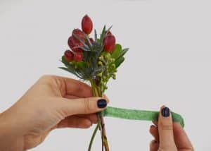 Wrapping the stems for DIY Groomsmen Boutonniere