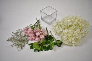 Make a Simple Hydrangea Centerpiece - Square glass vase, white Hydrangeas, pink spray rose,  Limonium and Pittosporum