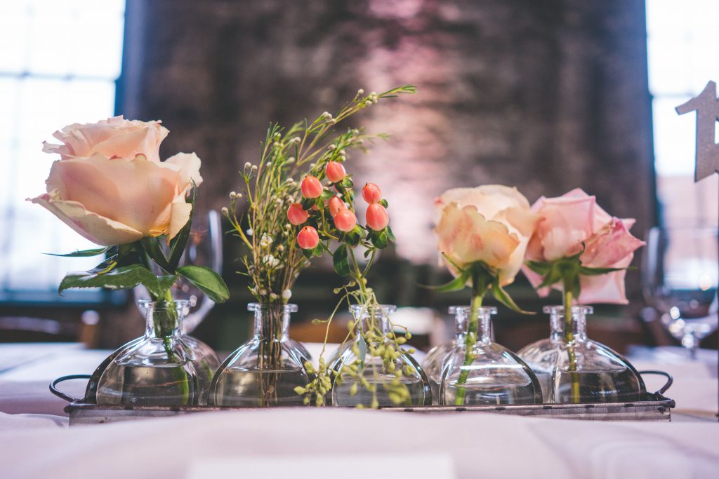Assorted flowers in small vases