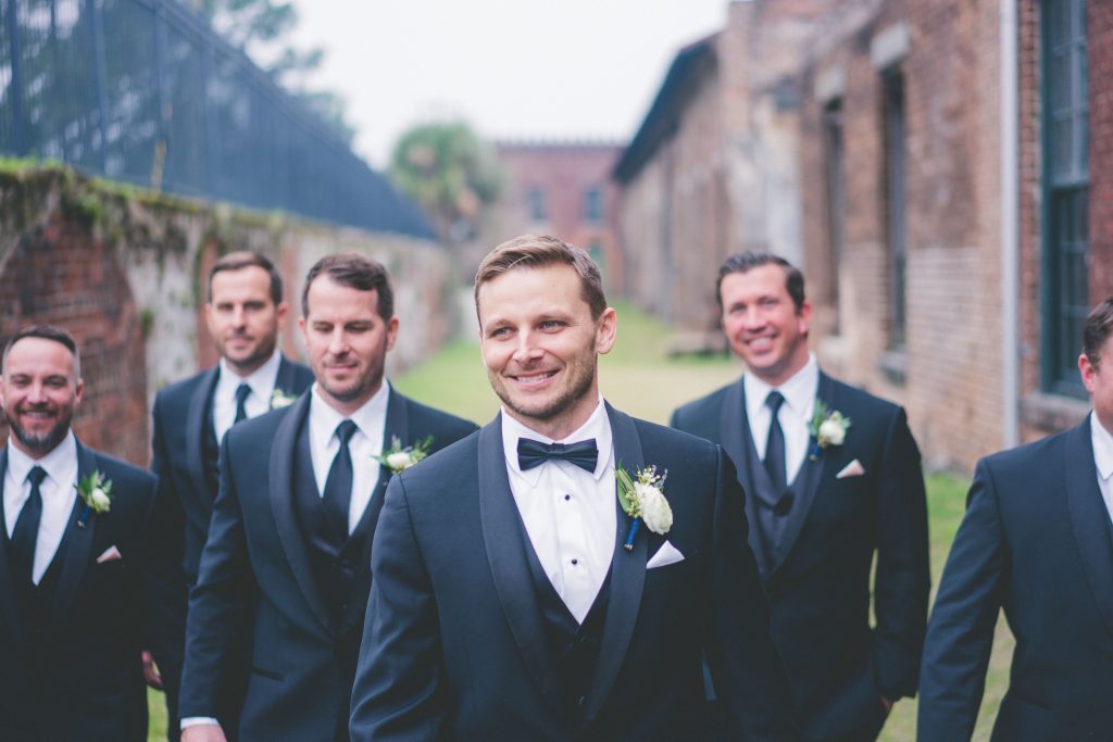 Groom and groomsmen with white boutonnieres
