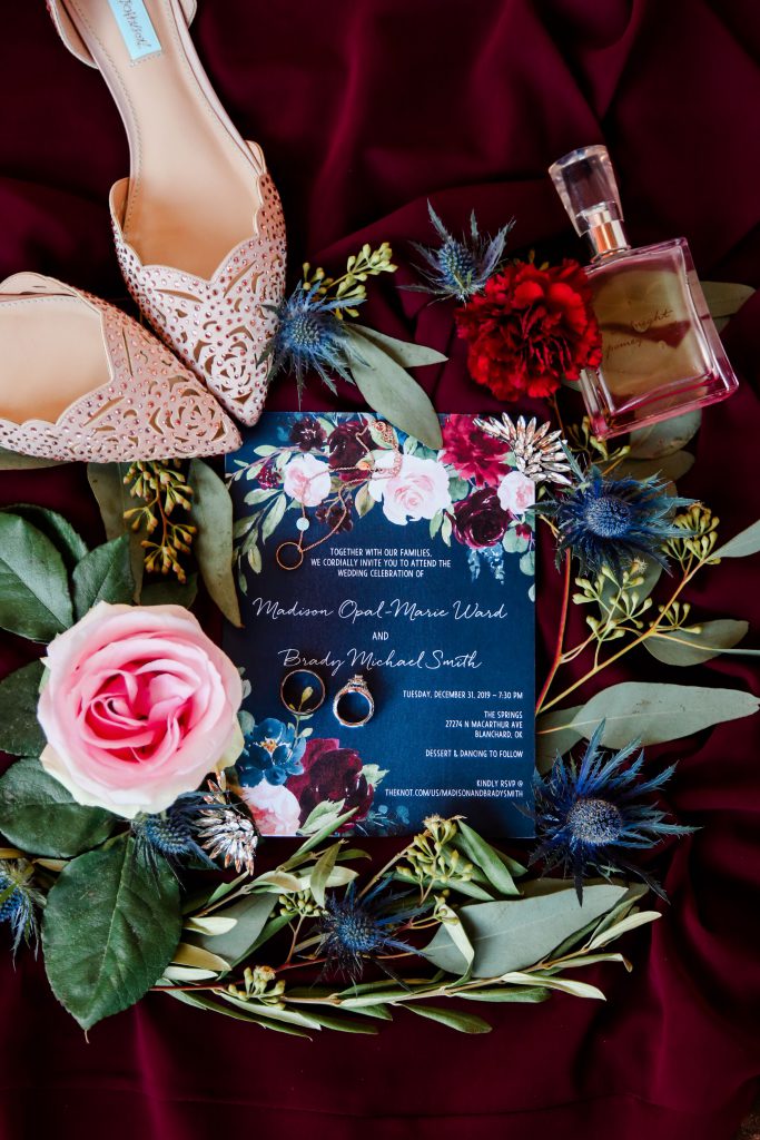 Wedding invitations, shoes, pink, blue and red flowers with perfume