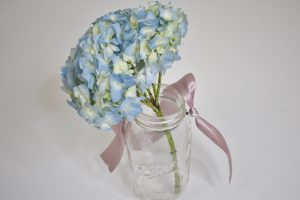 Adding Flowers to mason jar