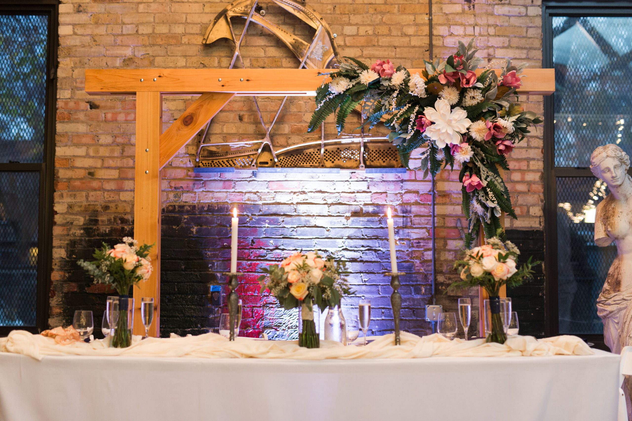 Flowers on a table with brick background