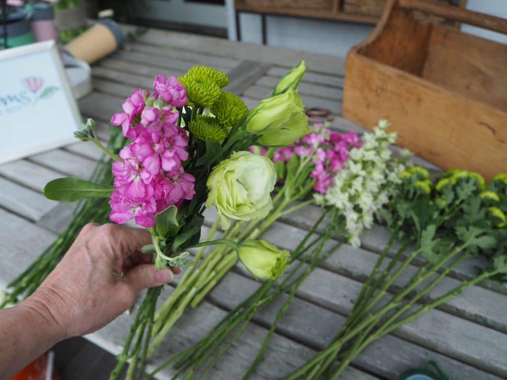 Grouping stems together for bouquet