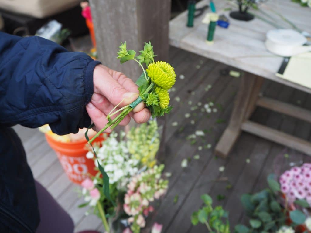 Taping stems for wildflower boutonniere