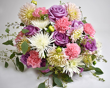 Adding pink carnations to the arrangement