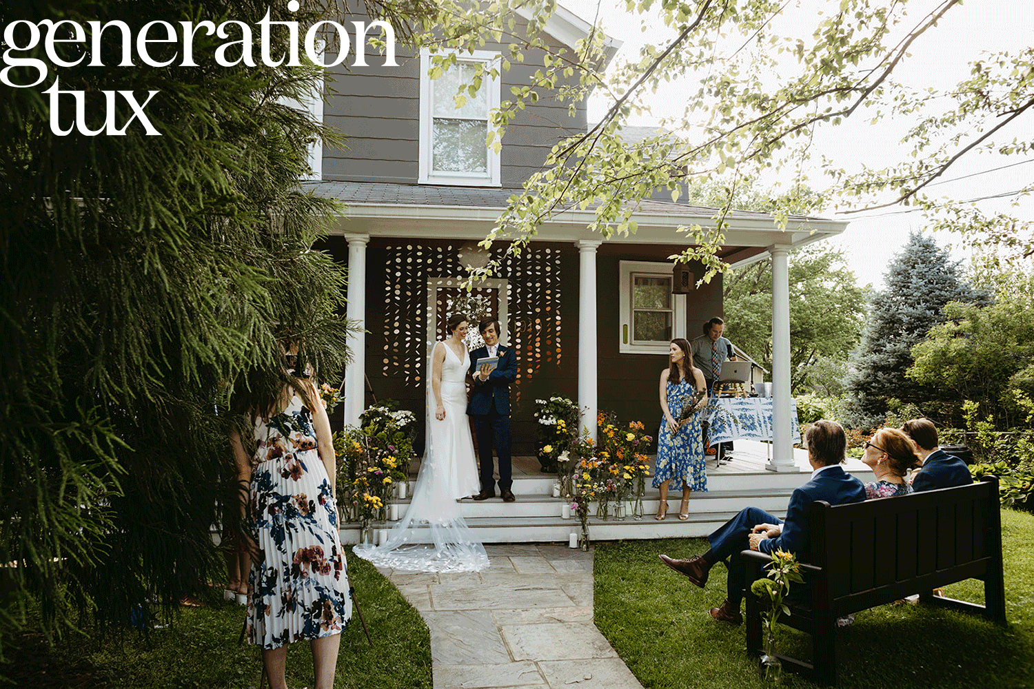 Wedding couple on front porch with lights and people sitting on a bench with the words generation tux