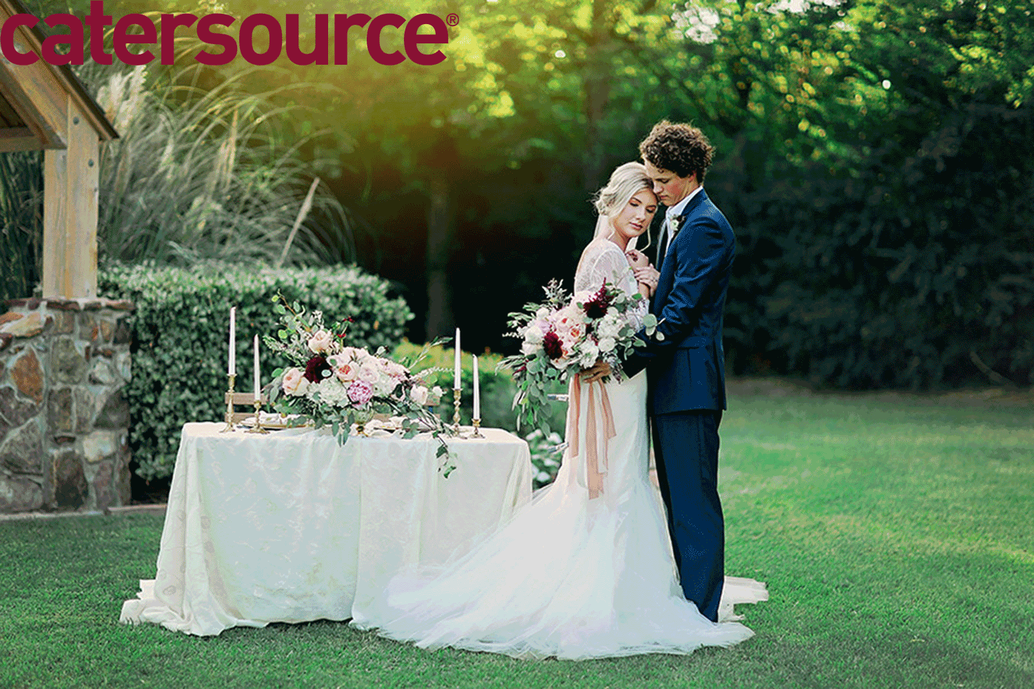 Wedding Couple Outdoors with table and word catersource