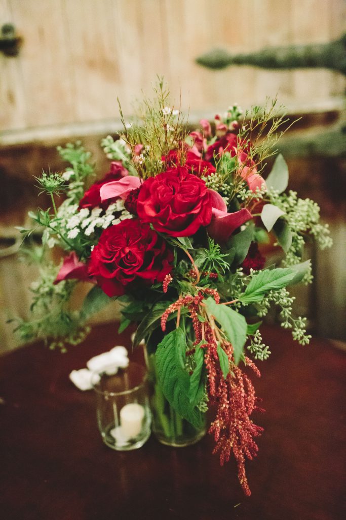 Red flowers in a vase on a table
