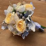 Finished bouquet with orange and grey flowers