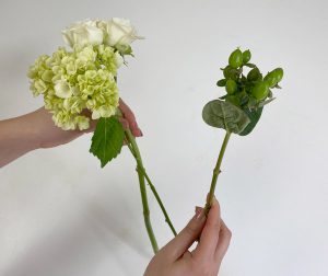 Putting flowers together to form bouquet