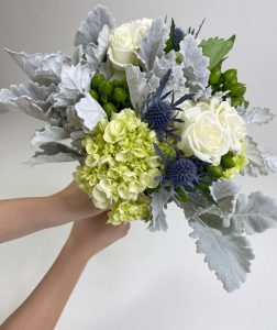 Hand holding the bouquet