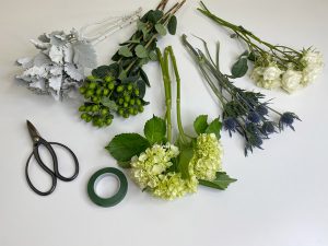 Photo of Supplies for Bouquet - Scissors, floral tape and various flowers