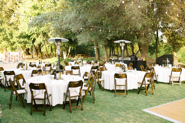backyard wedding with tables and chairs