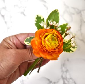 Ranunculus and wax flowers