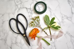 Ranunculus Boutonniere supplies - scissors, tape, flowers