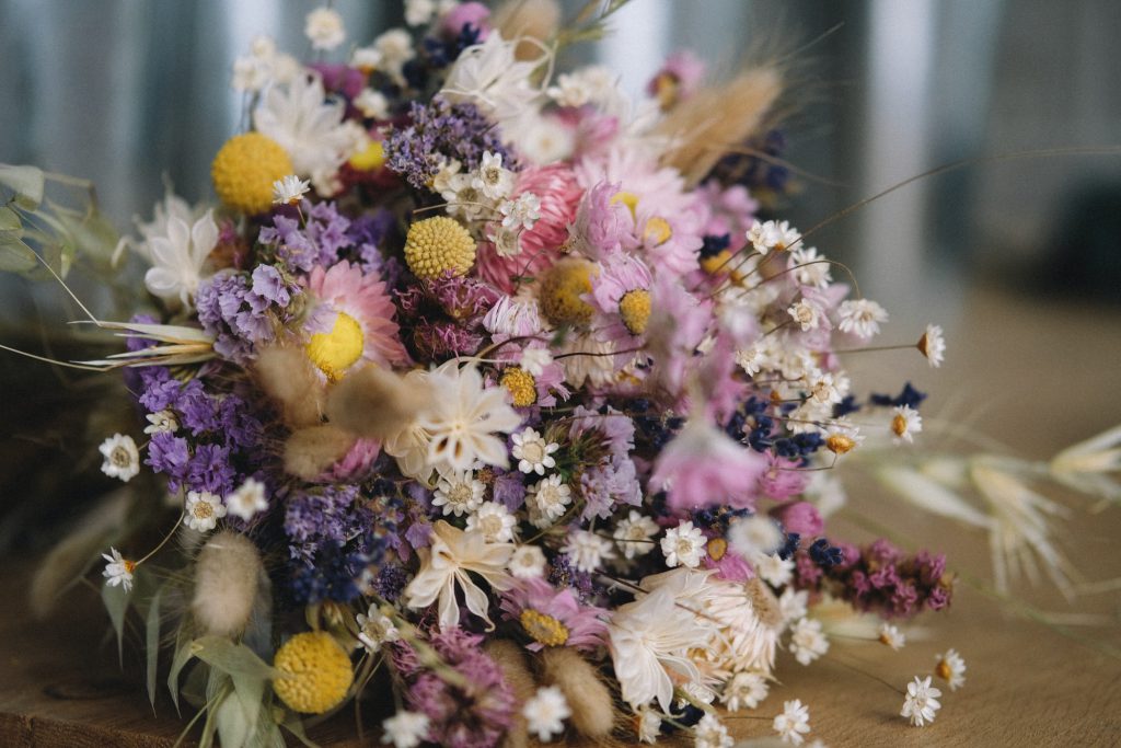 Mixed dried flowers with fresh-cut fall flowers and greenery