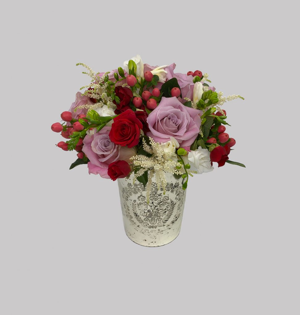 Hypericum berries, red spray roses, white freesia, white astilbe, faith roses
